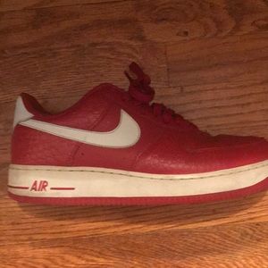 Red and white nike Air Force 1’s